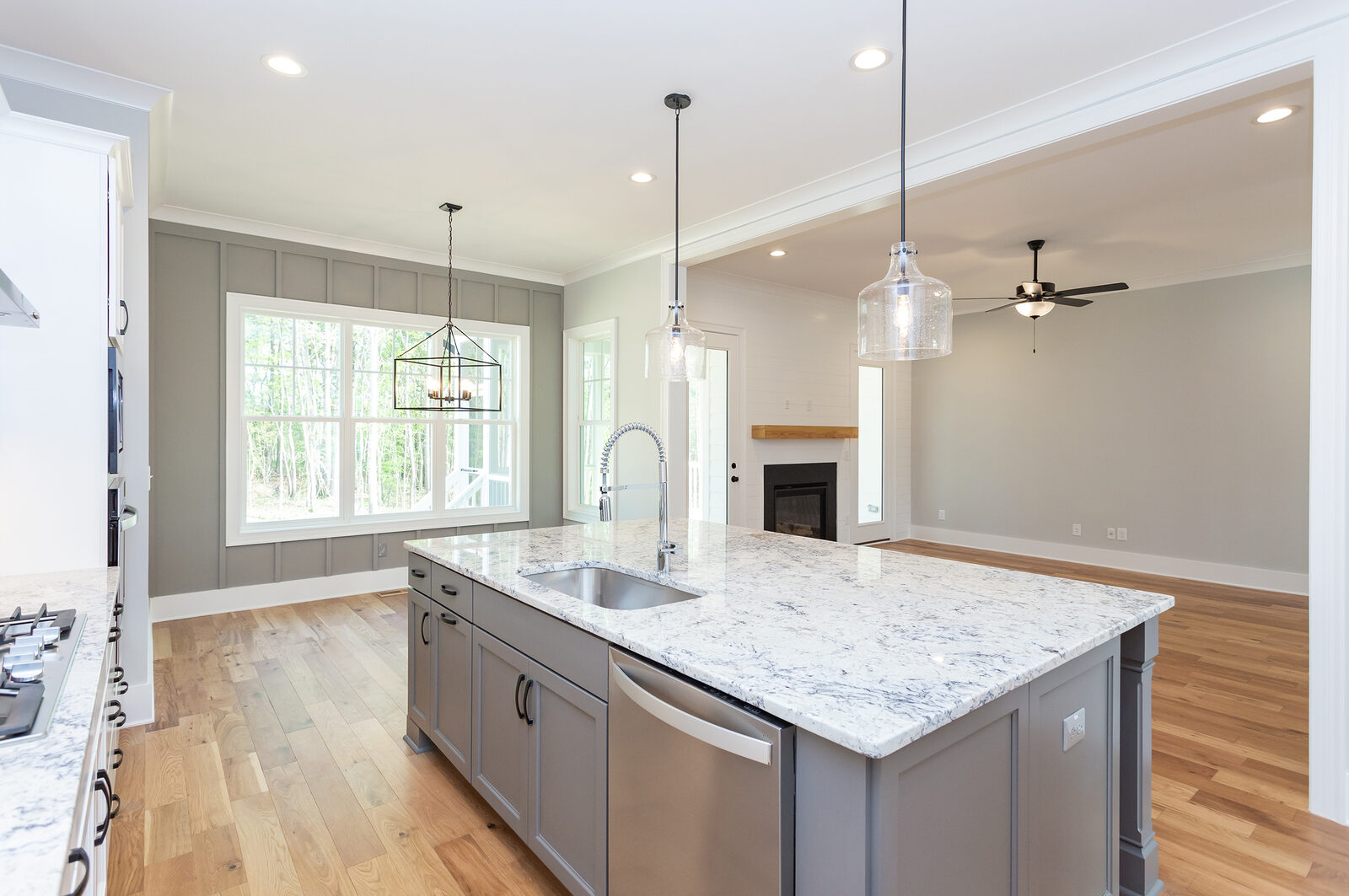 Open kitchen and great room in The Amber I, a Gemstone custom home