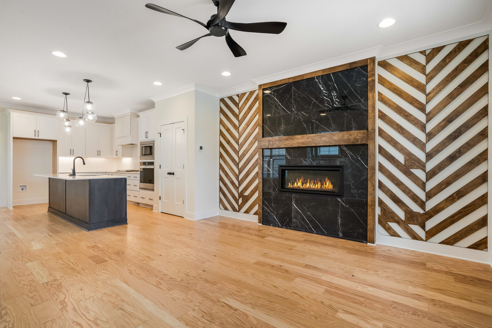Great room with fireplace in a Gemstone custom home