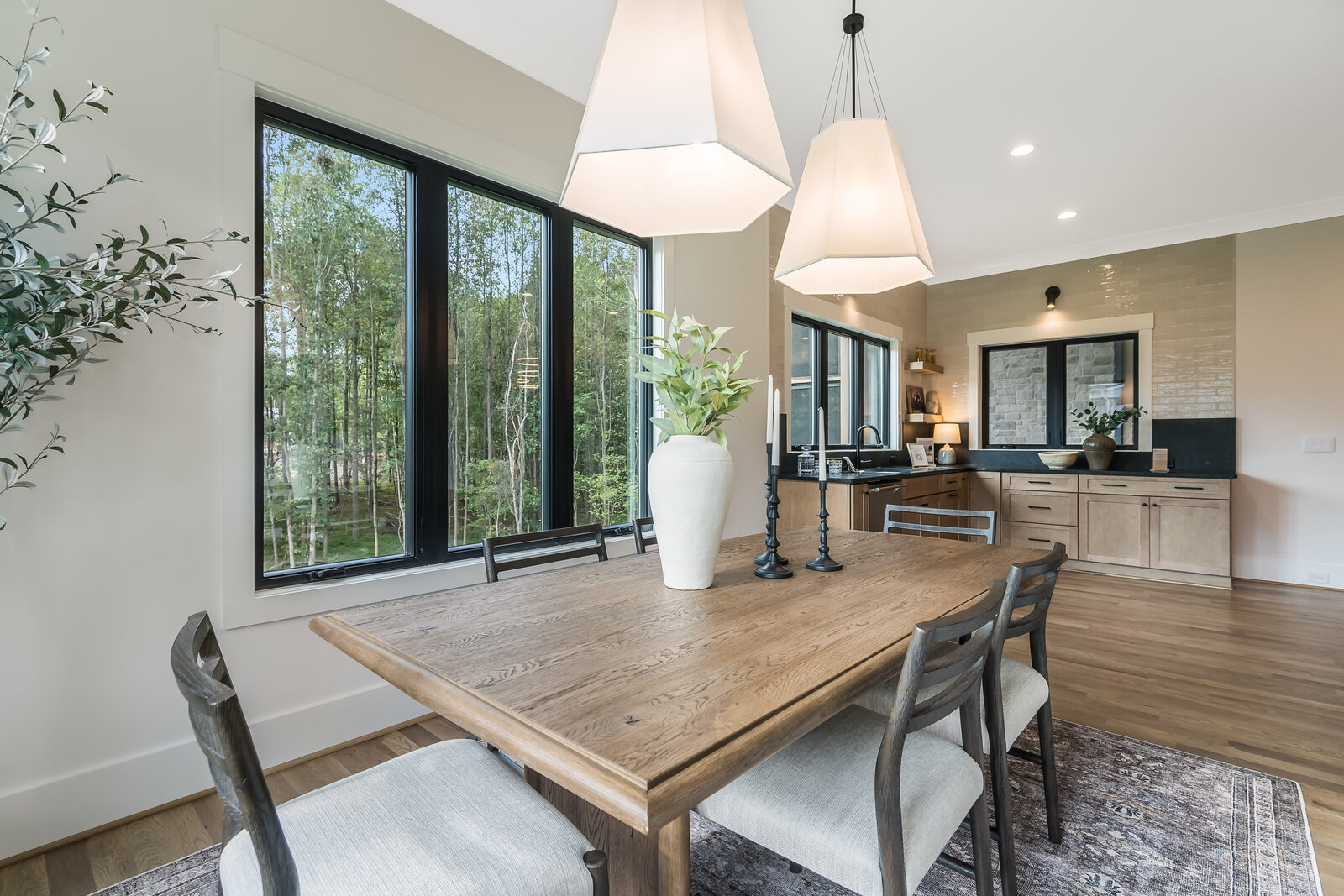 Interior of a Gemstone custom home, dining through to the kitchen