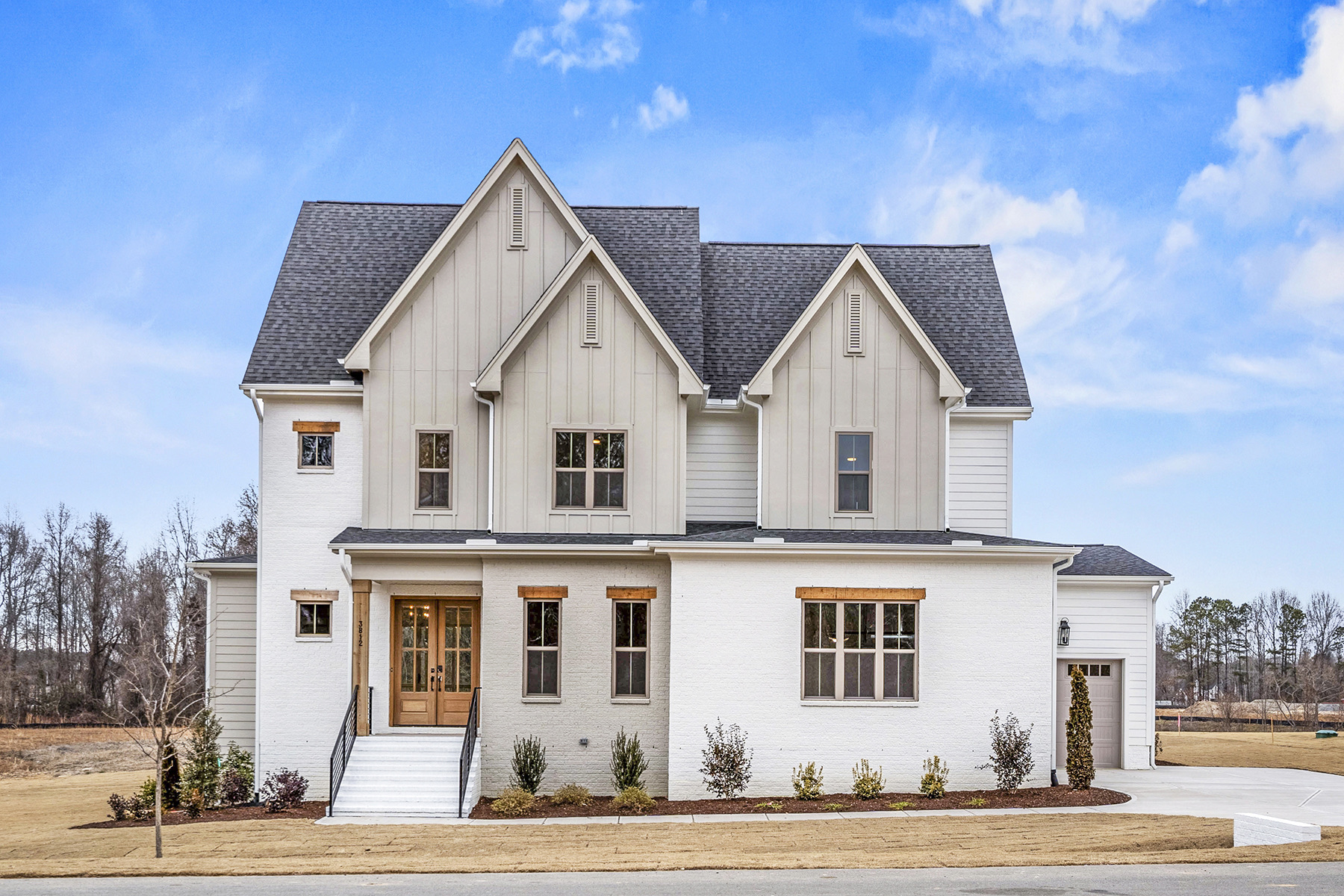 The Morefield, a Gemstone custom home with a cream board-and-batten exterior