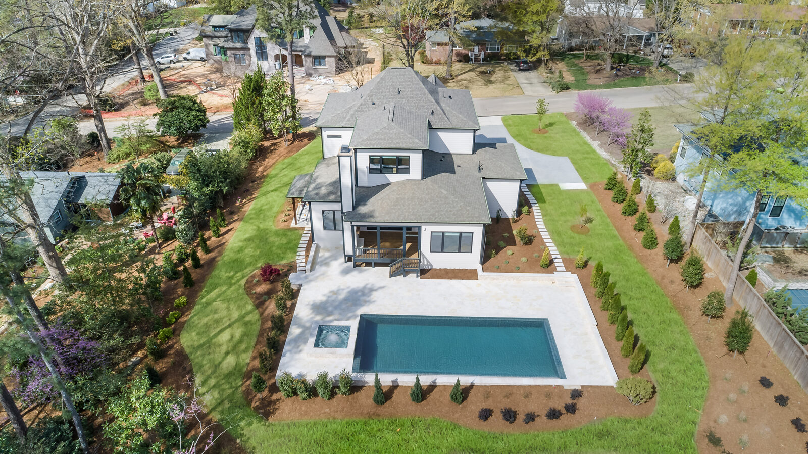 Aerial of a Gemstone custom home with a pool on Hinton Street in Apex, NC