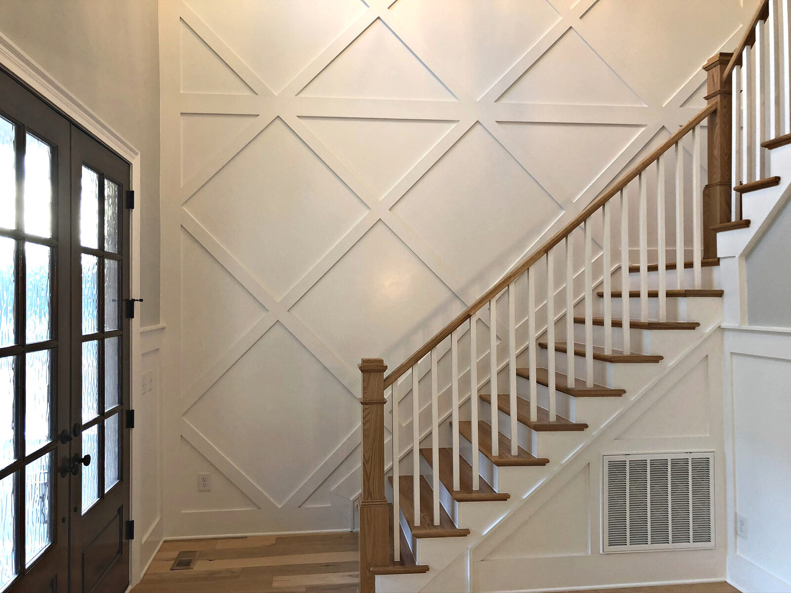 Lattice staircase detail in a Gemstone custom home