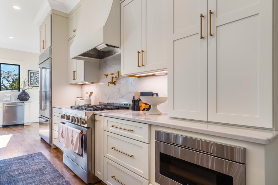 McLaurin Farms gourmet kitchen with brass fixtures and a professional range